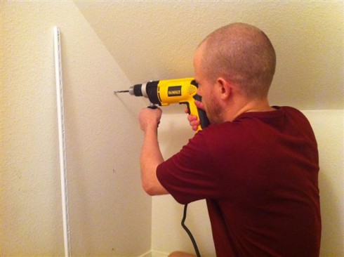 Jesse installing shelves